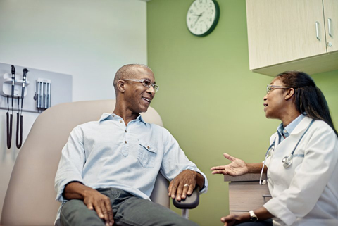 Physician speaking with patient