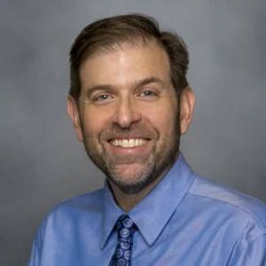 TR Levin in blue shirt with colorful tie