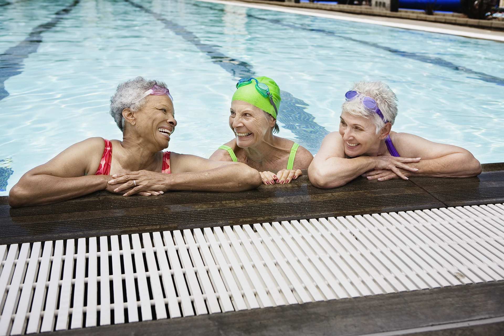 Three senior women in pool