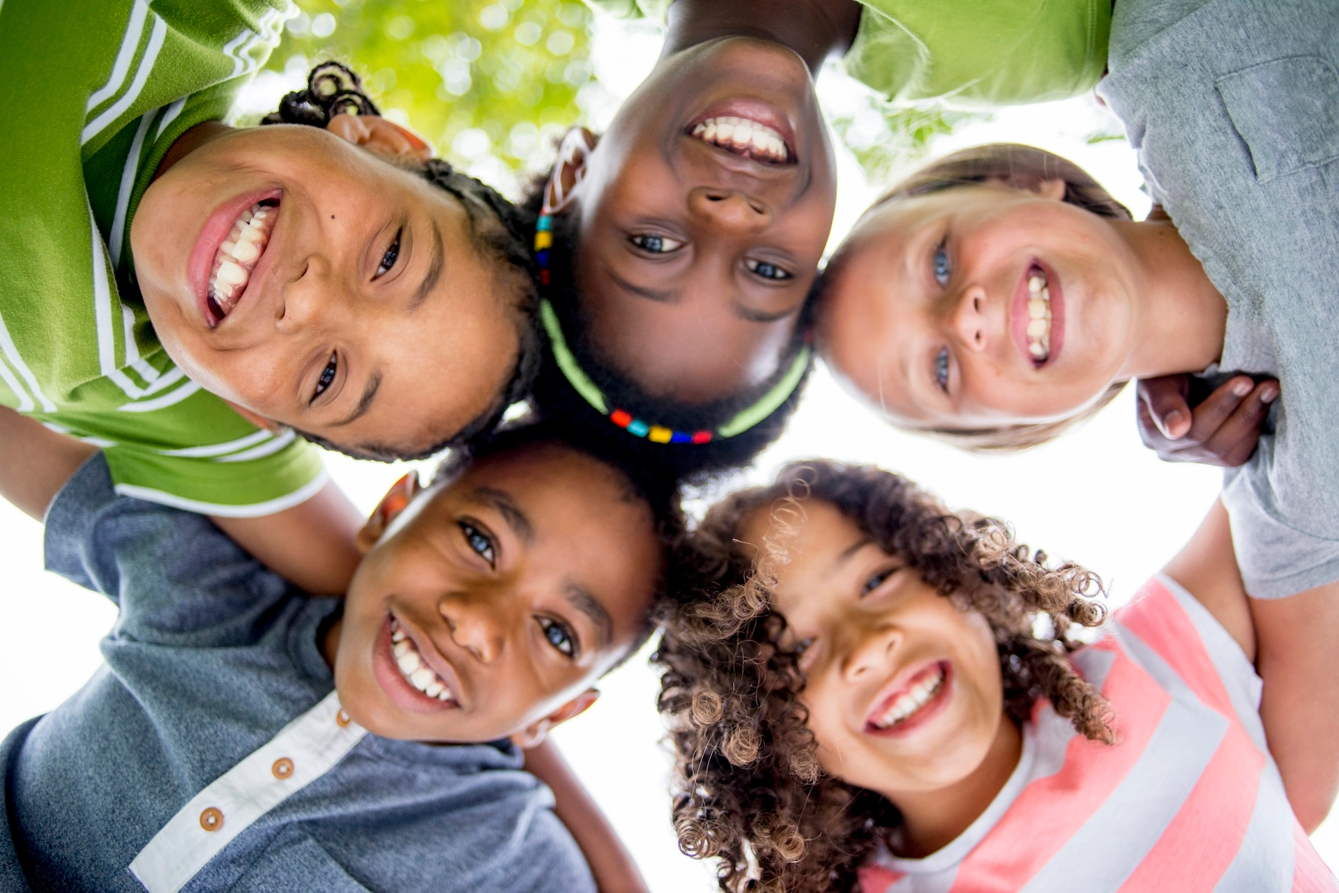 kids in a circle looking down